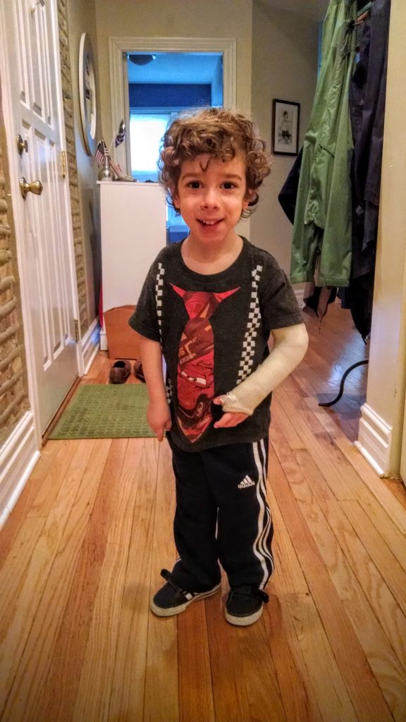 Aleck proudly showing his daddy his cast.  It hasn't slowed him down a bit.