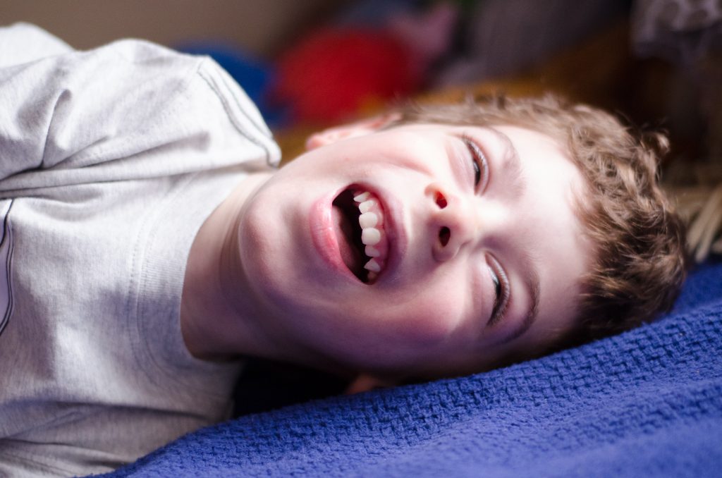 I love taking pictures of Aleck rolling around on a bed. I can shoot without worrying about him falling and we have the best time together.