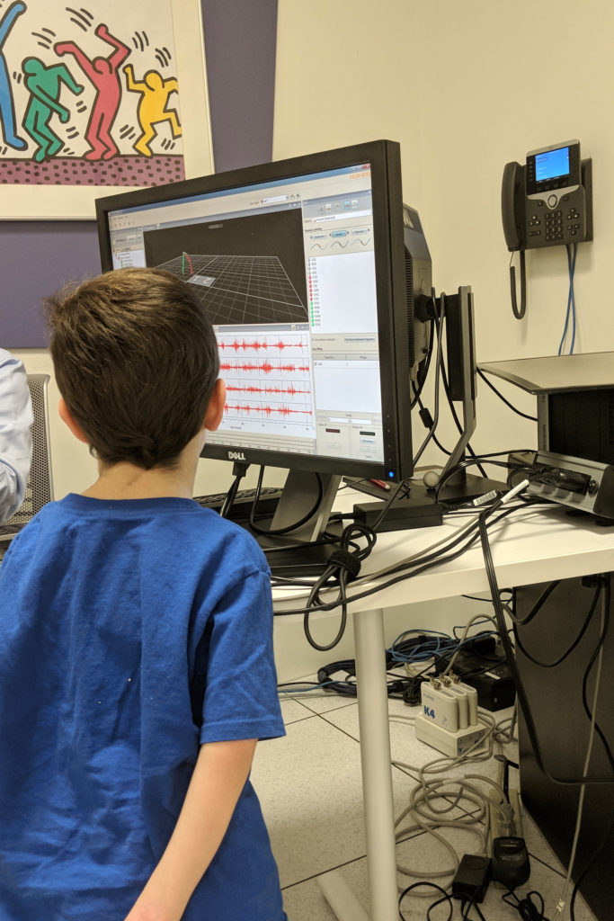 Aleck watching his computer self walking. 